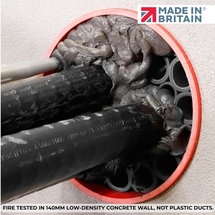 Close-up of cables sealed with grey fire-resistant compound and intumescent modules in 140mm concrete wall duct opening, showcasing fire-tested integrity.