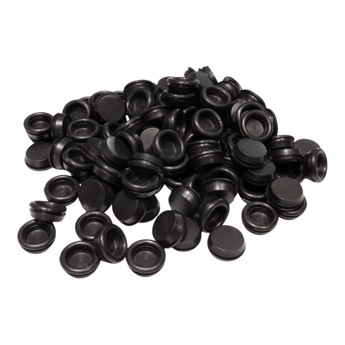 A pile of black PVC rubber grommets in various sizes, designed for cable protection.