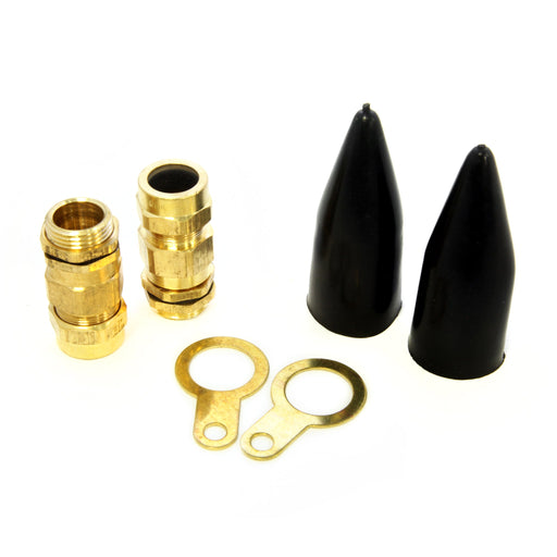 A set of brass cable glands with accompanying locknuts, earth tags, and LSF shrouds, with two black rubber elements visible.